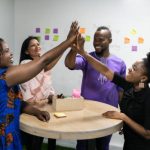 An image of a training session or workshop where employees are learning how to improve soft skills through practice and development.